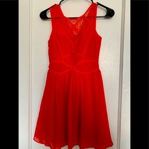 Red fit and flirty dress , lace trim at the top ..